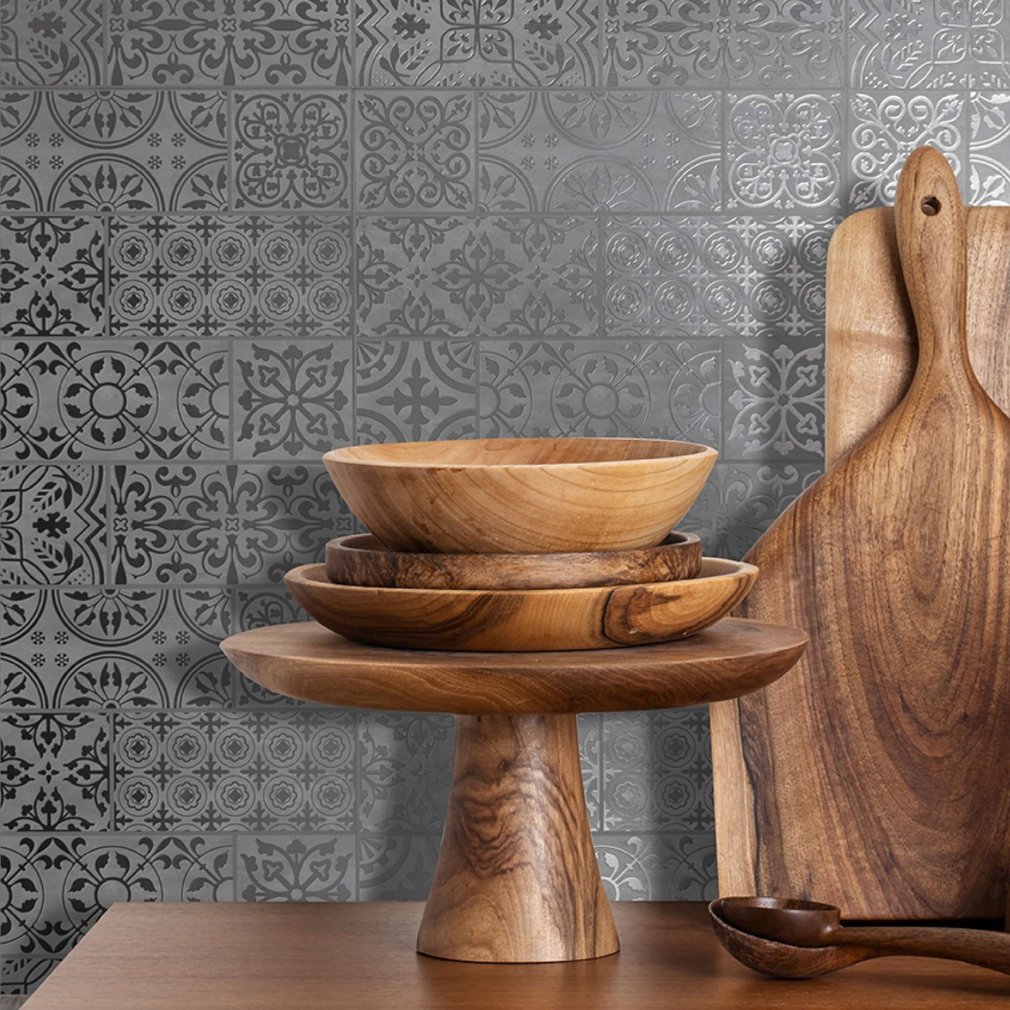 White Silver Inlay Moroccan-style tile wallpaper on a kitchen wall styled with wood bowls — peel and stick wallpaper that looks like patterned tile